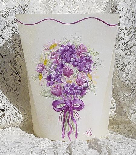 hand painted floral arrangement on a waste basket full view